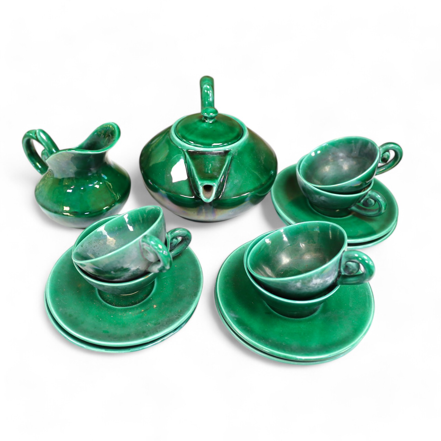 A Vallauris French bright green tea service, with six cups saucers milk jug and tea pot, jug 12.5cm high. Condition - fair to good